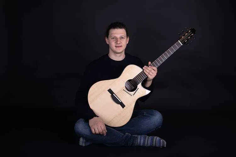 Luthier Max Spohn with guitar