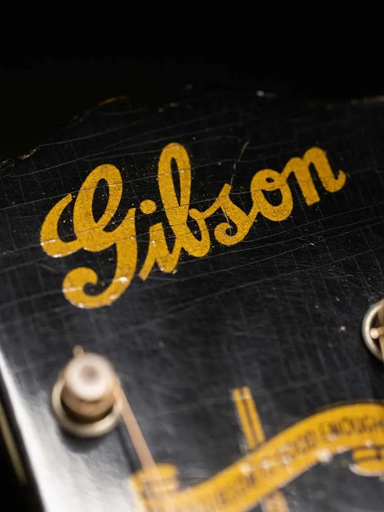 1945 Gibson J-45 acoustic guitar "banner logo" detail.