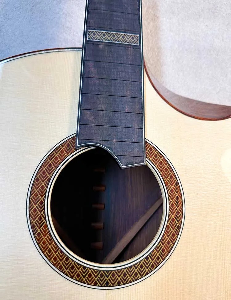 Turnstone guitar soundhole and fretboard intersection point