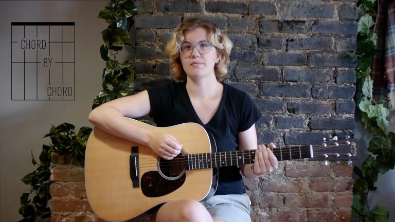 Acoustic Guitar and chord by chord contributor Kate Koenig seated with guitar