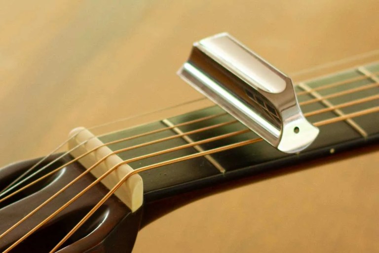 acoustic guitar with steel slide