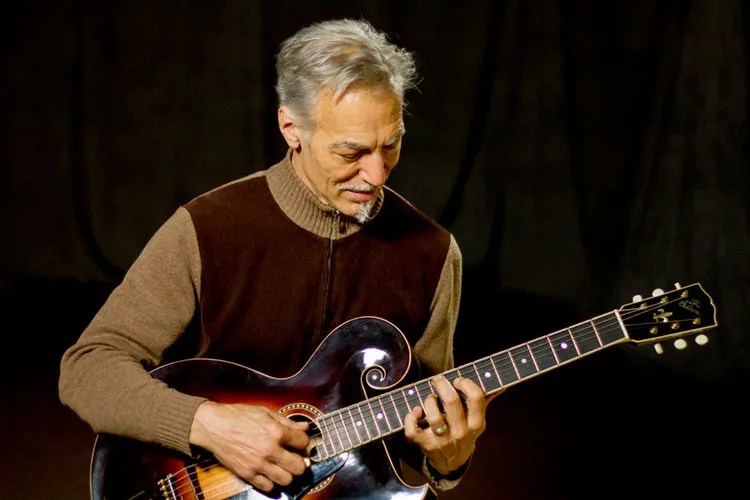 Paul Mehling performing on acoustic guitar.