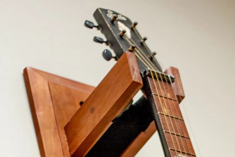 a guitar hanging on the wall