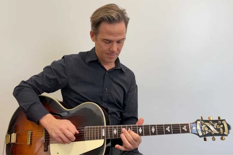 Greg Ruby teaches How to Visualize and Play Chords Up the Neck