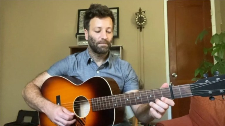 alan barnosky plays a guitar