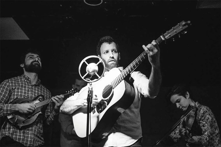 Alan Barnosky playing guitar onstage