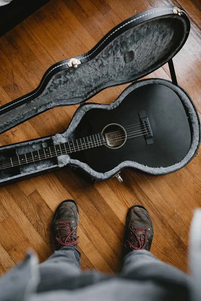 black guitar in hardcase