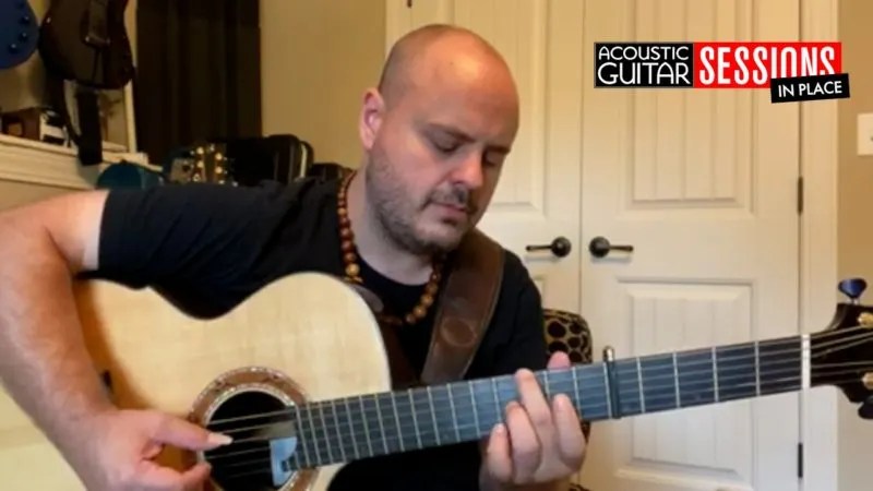 Andy McKee playing acoustic guitar