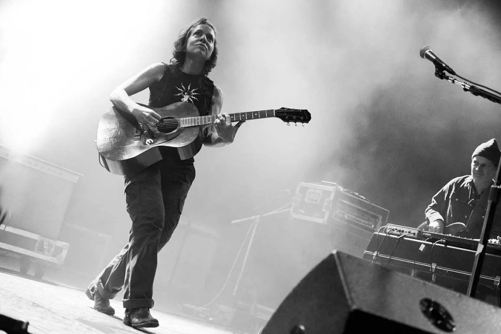 Ani-DiFranco plays guitar onstage. Photo by Anthony Mulcahy