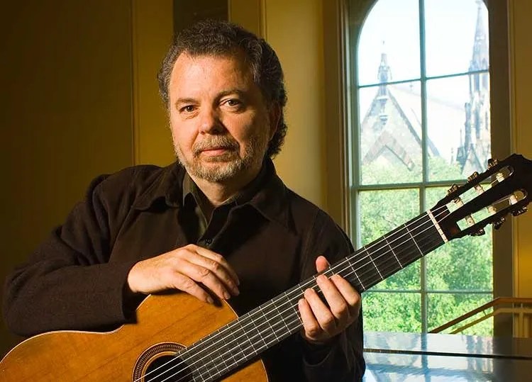 Manuel Barrueco poses with his guitar