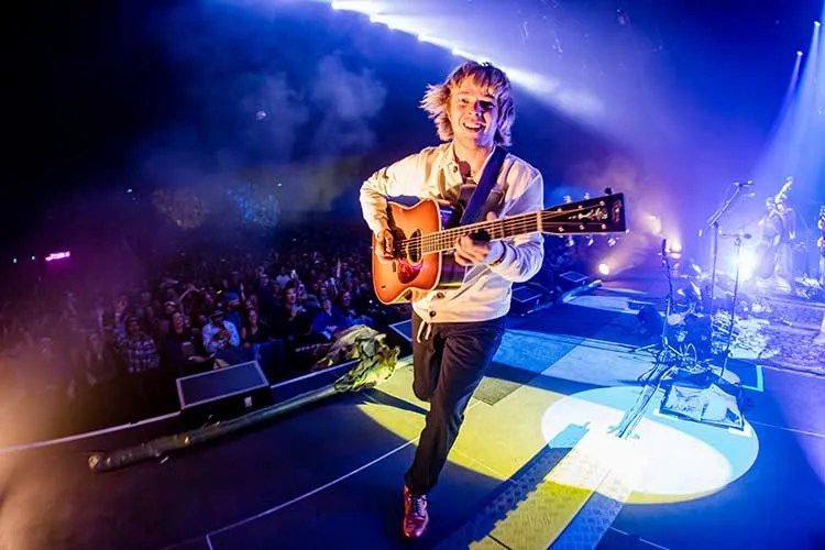 Billy Strings onstage with guitar