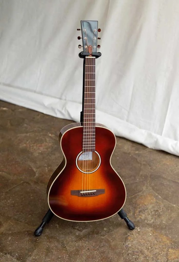 A sunburst acoustic guitar by luthier Eve Meister