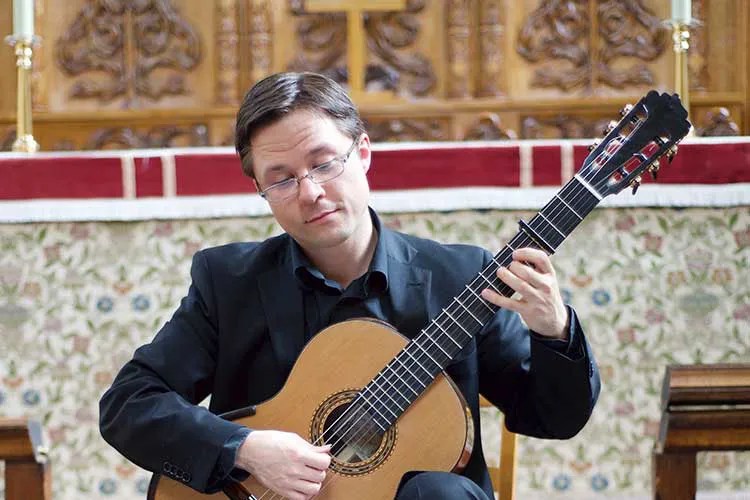 This Is Classical Guitar's Bradford Werner plays guitar with capo at third fret