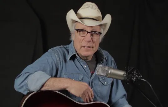 Maurice Tani with acoustic guitar