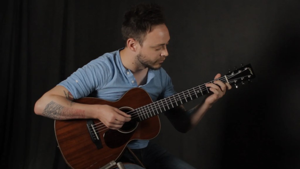 Guitarist Charlie Rauh performs a song in the Acoustic Guitar video studio