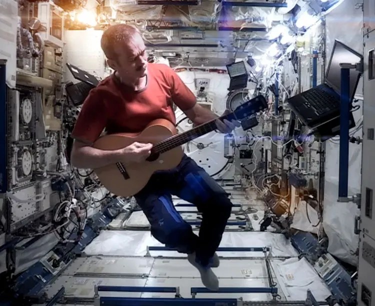 Chris Hadfield plays parlor guitar in outer space