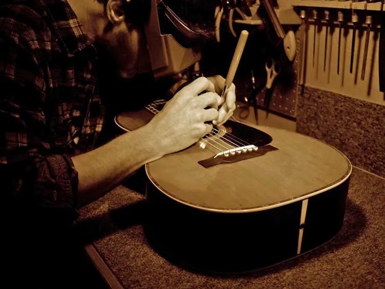 Luthier and instrument restoration specialist David Eichelbaum at his workbench