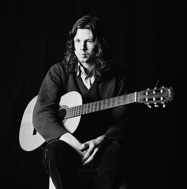 Nick Drake with his guitar