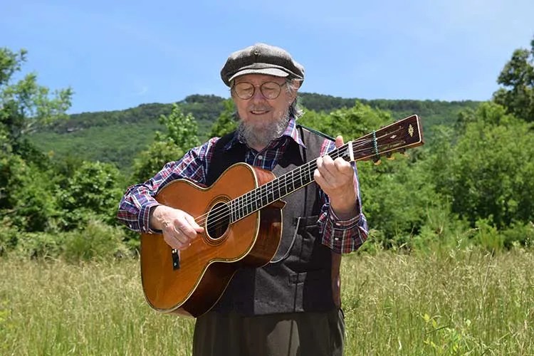 Norman Blake playing acoustic guitar