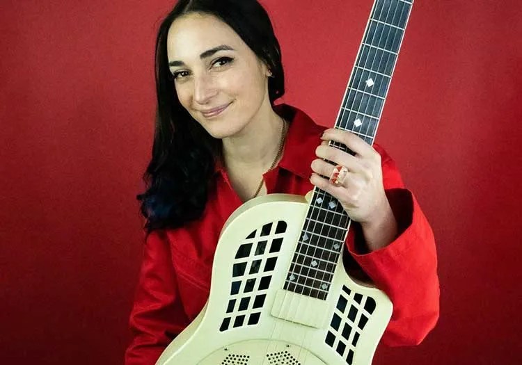 Christina Vane poses with her guitar