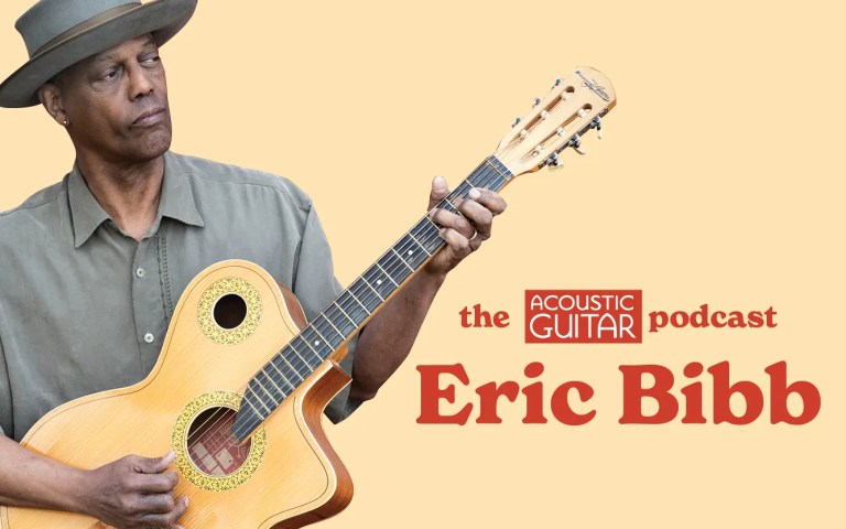 Eric Bibb posed with his acoustic guitar + the acoustic guitar podcast logo