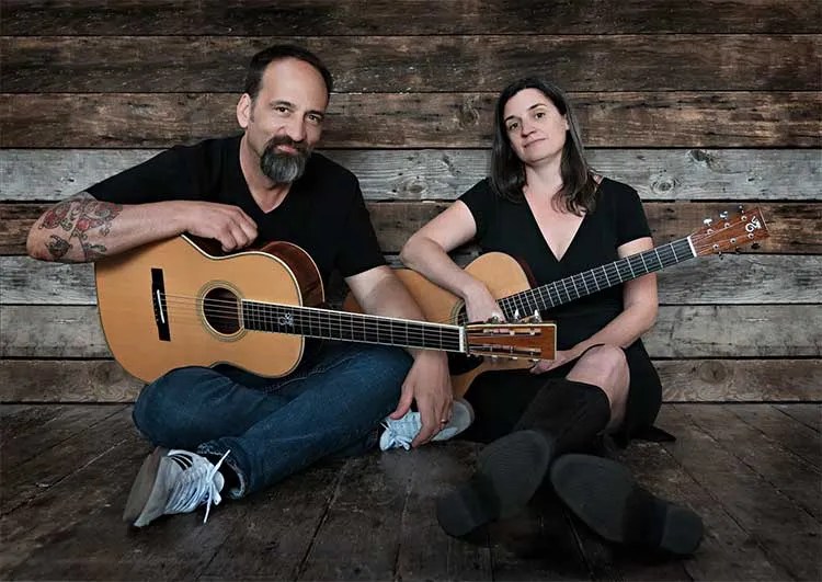 Eric Skye and Jamie Stillway seated with Santa Cruz acoustic guitars