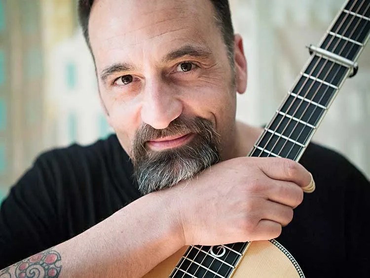 Eric Skye with guitar. Photo by Jamie Bosworth