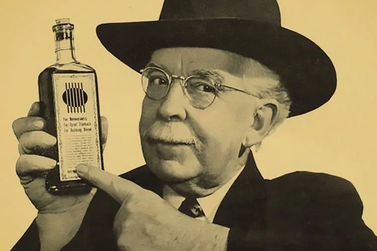 old-time photo of a snake oil salesman