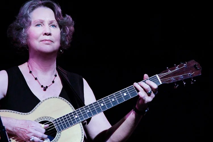 Mary-Flower-playing-acoustic-guitar