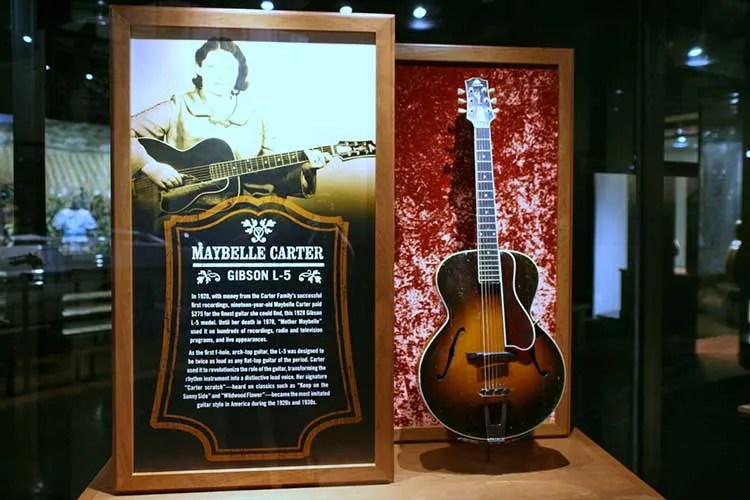 Maybelle Carter exhibit showing her 1928 Gibson L-5 acoustic guitar