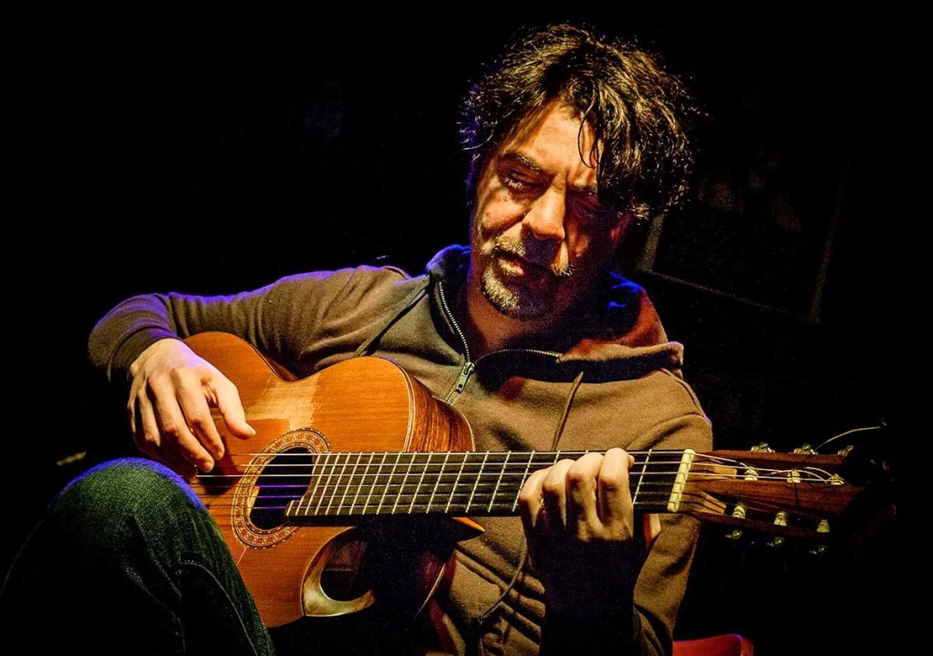 Goran Ivanovic playing acoustic guitar