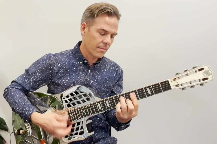 guitarist Greg Ruby playing a National resonator guitar