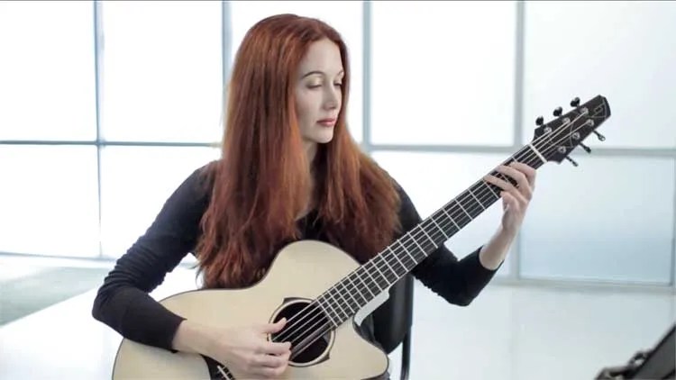 gretchen menn plays an acoustic guitar in the AG studio