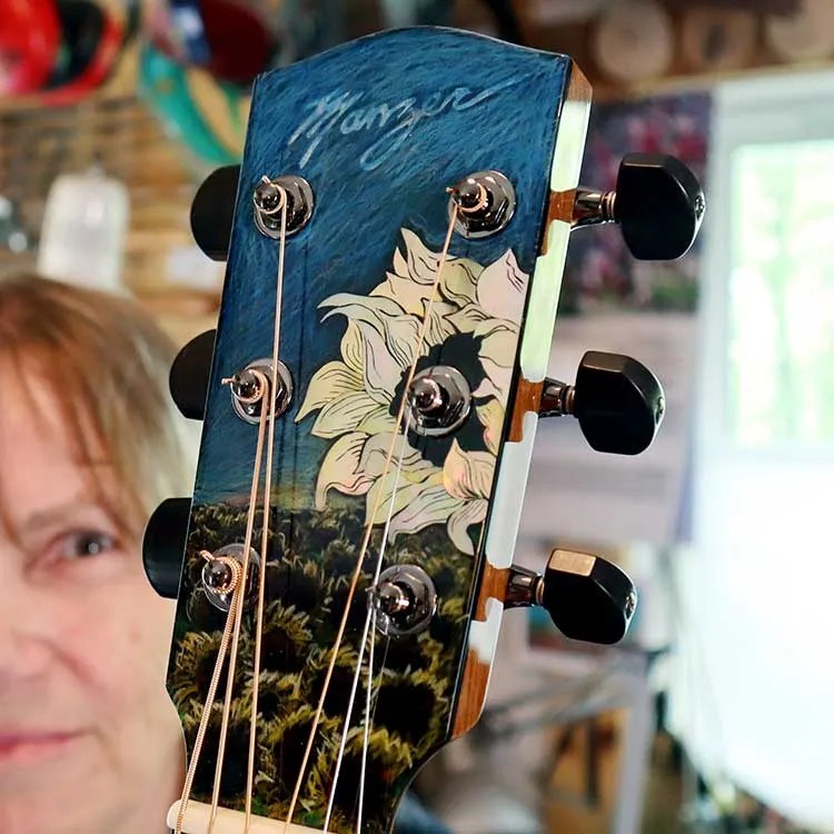 Linda Manzer with her Sunflower Guitar for Ukraine