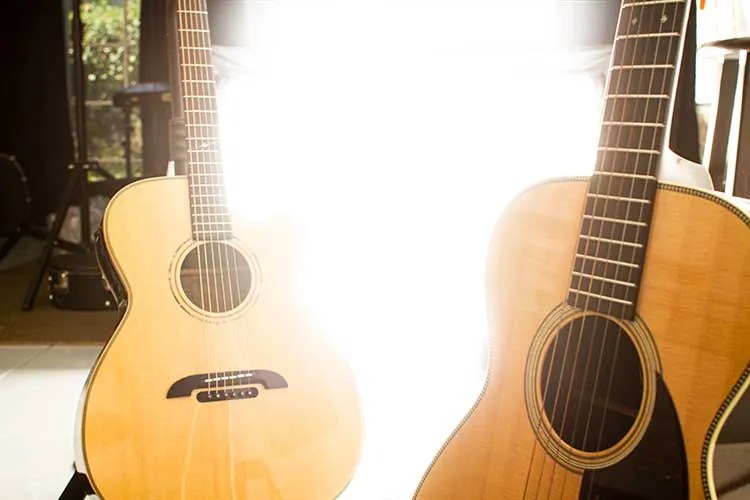 Two acoustic guitars with bright light