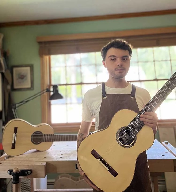 Luthier Brian Itzkin holding guitar