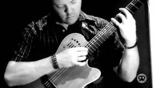 Jeff Gunn plays percussive acoustic guitar.