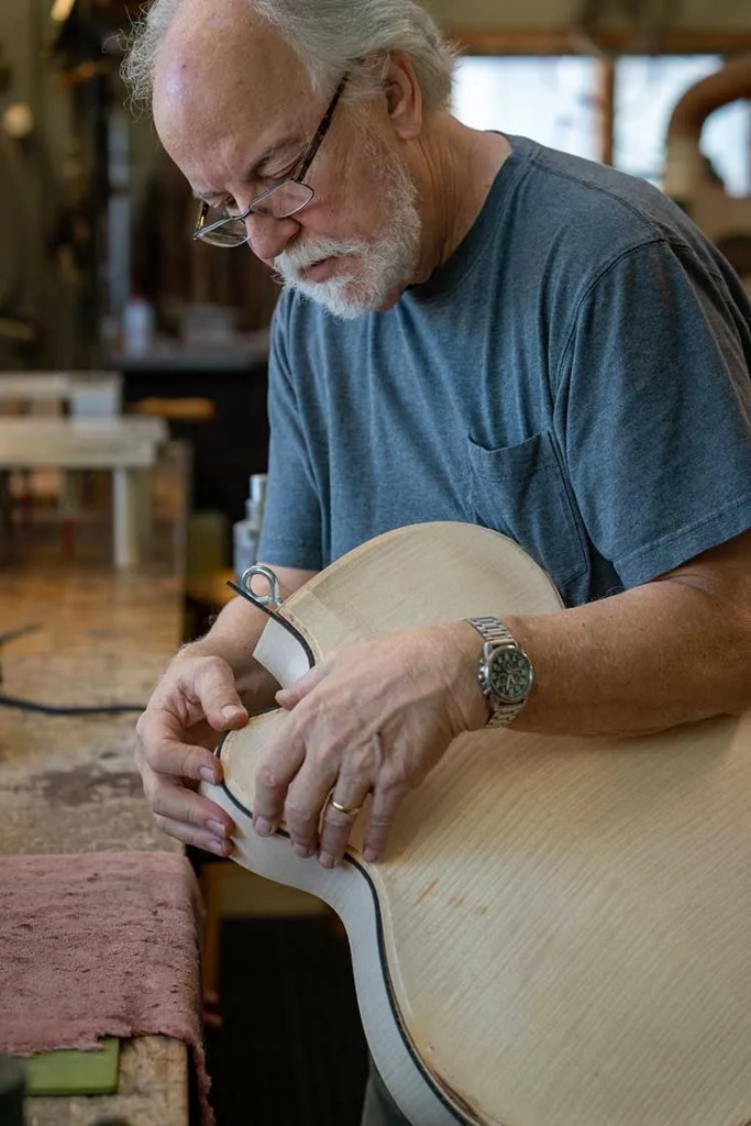 John Monteleone adding purfling to an archtop guitar