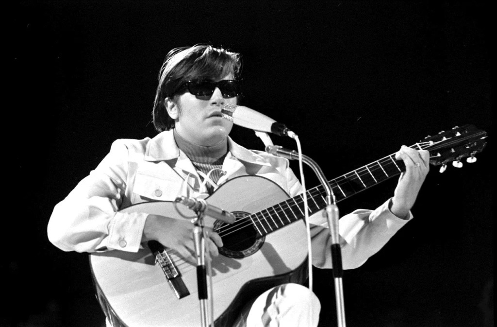 jose feliciano holding a nylon-string guitar