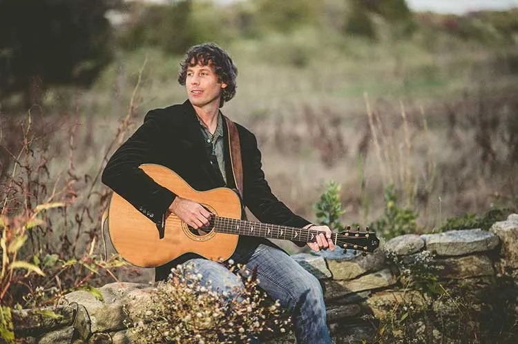 Jesse Terry with acoustic guitar