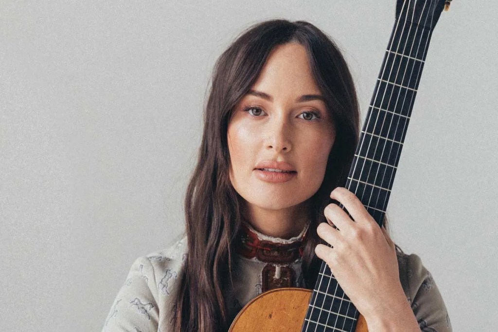 Kacey Musgraves with acoustic guitar