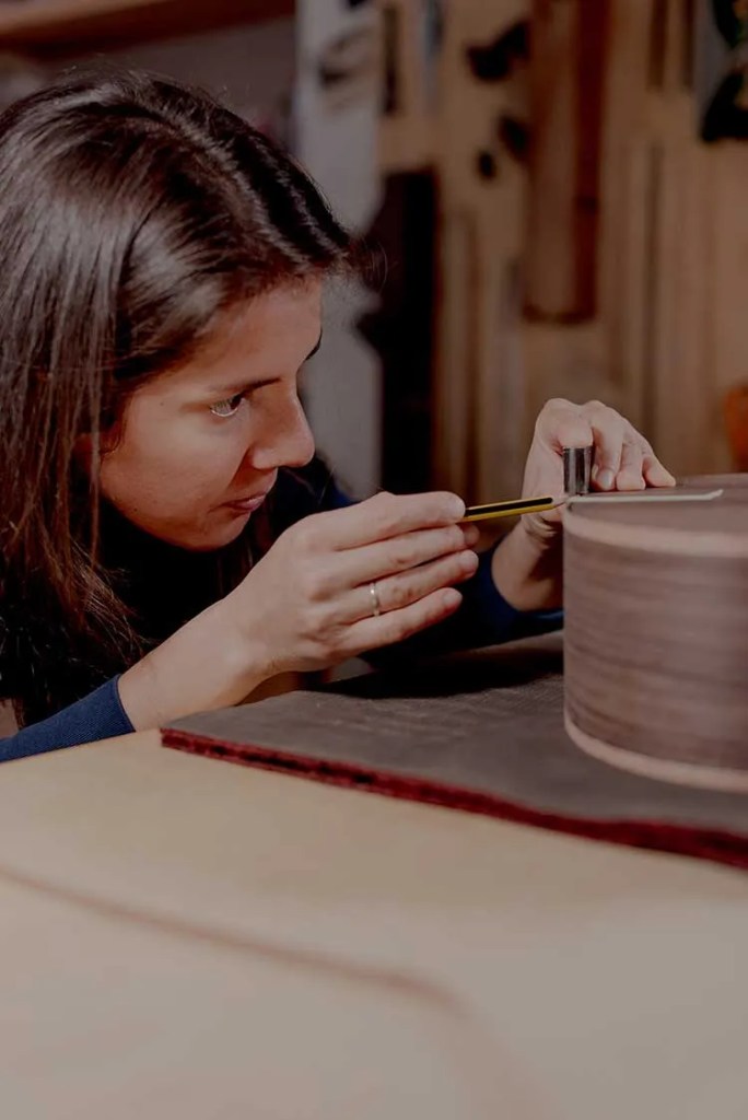 Noemi Schembri working on a guitar