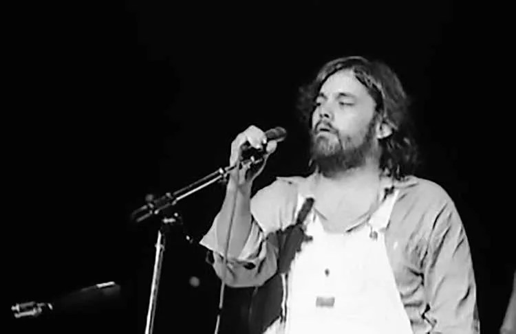 Little Feat's Lowell George in front of a microphone - photo by Jean Luc