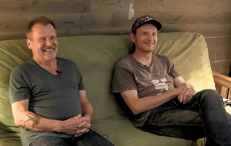 Martin Simpson and Thomm Jutz seated and smiling