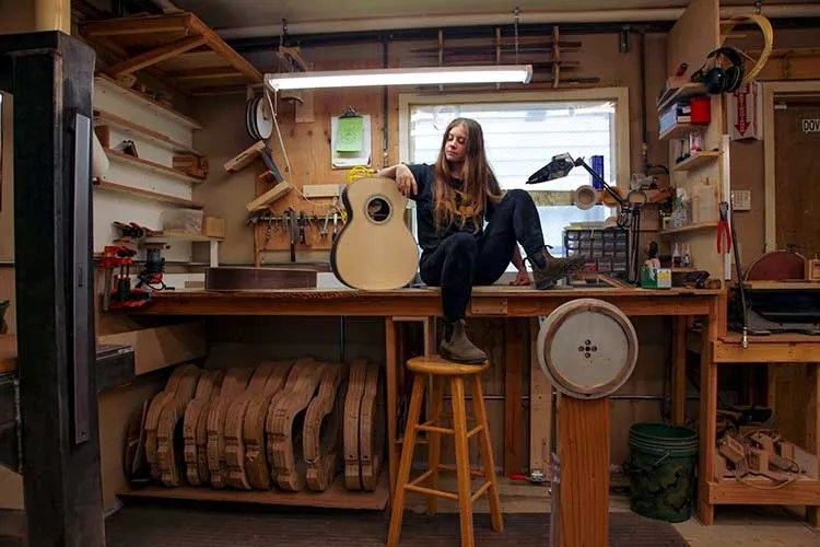 Guitar luthier Olivia Elian at her workbench