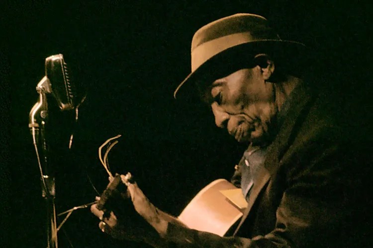 Mississippi John hurt with guitar