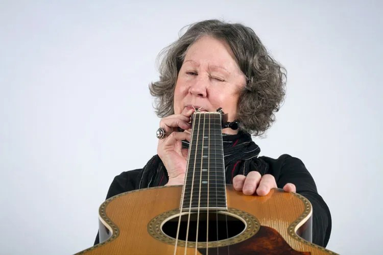 Checking the neck of a guitar