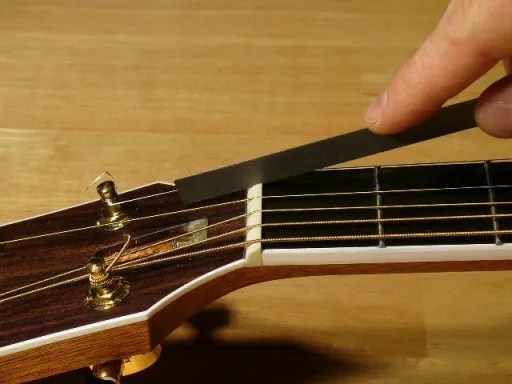 an acoustic guitar nut slot