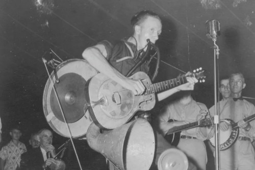 black and white photograph of a one-man band