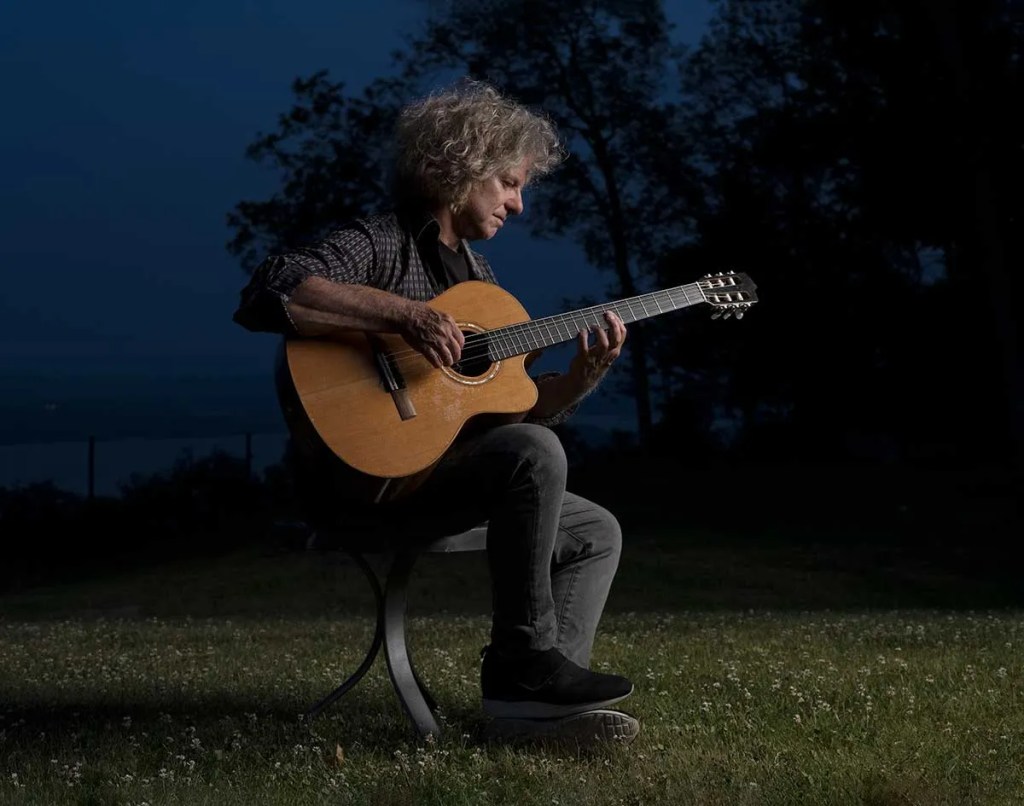 Pat Metheny playing his Manzer baritone guitar. Photo by James Katz